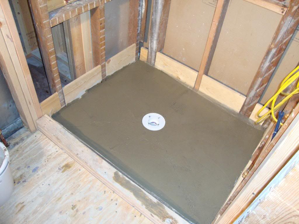 new tile shower leaking AGAIN